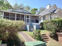 Charming bungalow with screened porch and landscaped yard at 988 Herndon Nw St, Atlanta, GA 30318