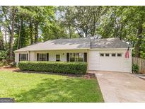 Ranch style home with attached garage at 216 Colemans Bluff Dr, Woodstock, GA 30188