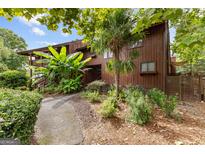 Inviting exterior with a walkway and lush landscaping at 12 Fairway Ln, Peachtree City, GA 30269