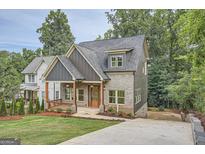 Modern two-story home with gray siding and a front porch at 1055 Church St, Smyrna, GA 30080