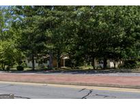 Two houses partially visible behind trees at 4556 Wade Green Nw Rd, Acworth, GA 30102