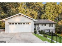 Two-car garage with driveway at 7325 Czar Pl, Riverdale, GA 30296