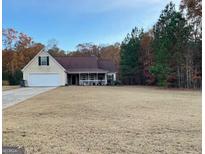 Ranch style home with attached garage and spacious yard at 156 Buddy Blvd, Mcdonough, GA 30252