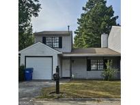 House exterior, featuring a garage and front yard at 602 Pine Tree Trl, College Park, GA 30349