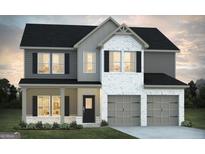 Two-story house with gray siding, brick accents, and a two-car garage at 268 Brooks Drive # 77, Fairburn, GA 30213