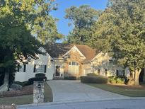 House exterior featuring stone and vinyl siding at 1461 Hada Ln, Lawrenceville, GA 30043