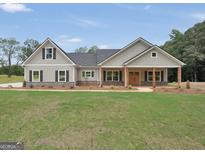 New craftsman style home with covered porch and large front yard at 585 Highway 155 North N, Mcdonough, GA 30252