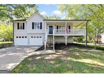 Two-story home with attached garage and front porch at 179 Runnell W Rd, Rockmart, GA 30153