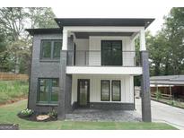 Modern two-story home with dark brick and white accents at 3299 Sims St, Hapeville, GA 30354