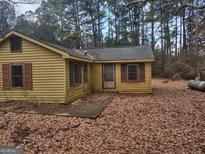 Yellow single story house with a small front porch at 360 Ne Glenn Rd, Conyers, GA 30013