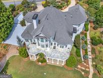 Luxury home with large deck and landscaped grounds at 115 Eagles Club Dr, Stockbridge, GA 30281