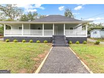 Charming renovated bungalow with a large front porch at 26 Pool Woods Dr, Grantville, GA 30220