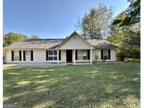 Single story house with a well maintained lawn at 753 Keys Ferry Rd, Mcdonough, GA 30252