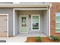 Inviting front entry with a light green door at 1920 Schoolhouse Ln # 9, Temple, GA 30179