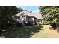 Two-story house with columns and a large lawn at 5335 Saville Dr, Acworth, GA 30101