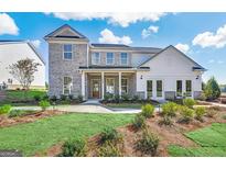 Two-story home with gray brick and white siding at 3146 Morris Hills Dr, Dacula, GA 30019