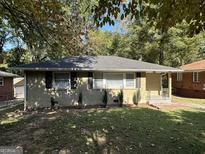 Brick Ranch home with a well-maintained lawn at 739 Yale Sw Pl, Atlanta, GA 30315