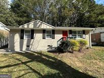Charming ranch home with red door at 1154 Penn Ct, Atlanta, GA 30315
