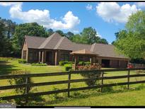 Brick house with attached garage and gazebo at 7866 Hwy 54, Sharpsburg, GA 30277