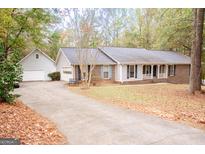 Ranch-style home with a brick facade and attached garage at 130 Greenridge Ct, Fayetteville, GA 30215