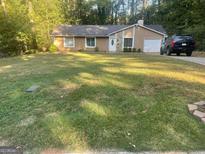Charming single-story home with attached garage and large front yard at 2893 Franklin Rd, Lawrenceville, GA 30044