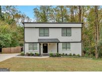 Modern two-story house with white siding and black accents at 2147 Mcafee Rd, Decatur, GA 30032