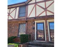 Brick townhouse exterior with double doors at 3290 Abbeywood Dr, Decatur, GA 30034