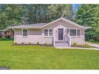 Updated Ranch home with landscaped lawn and front steps at 1764 Thomas Ter, Decatur, GA 30032