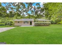 Ranch home with a large front yard at 5950 Community Se Rd, Mableton, GA 30126