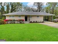 Ranch style home with carport and well-maintained lawn at 2138 Springdale Rd, Atlanta, GA 30315