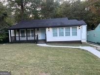 Charming single story home with a newly landscaped lawn and walkway at 2037 Conrad Se Ave, Atlanta, GA 30315