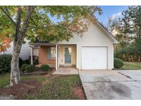 Cute ranch home with attached garage and small front yard at 167 London Dr, Mcdonough, GA 30253