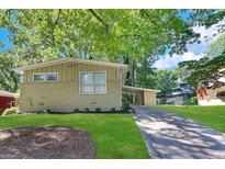 Brick ranch home with carport and landscaped lawn at 2302 Montrose Dr, East Point, GA 30344