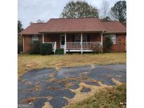 Brick ranch house with front porch and carport at 240 Chambers Rd, Mcdonough, GA 30253