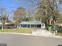 Ranch style home with front porch and yard at 2193 Abner Pl, Atlanta, GA 30318