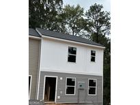 New construction home with gray and white siding at 7238 Crestside Dr # 79, Austell, GA 30168