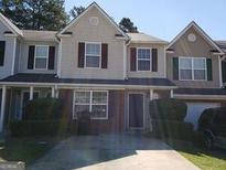 Two-story townhome with attached garage and driveway at 5330 Creekview Ln, Morrow, GA 30260