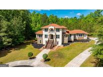 Luxury two-story home with stone accents and a circular driveway at 2089 Highway 85 S, Fayetteville, GA 30215