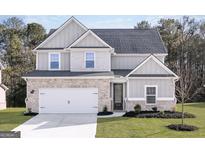 Two-story house with gray siding, brick accents, and a white door at 3413 Arabian Farm Ln, Dacula, GA 30019