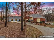 Brick home with 3-car garage and landscaped yard at 240 Edna Ruth Ln, Mcdonough, GA 30253