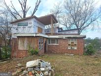 Brick house under construction, with new addition and deck at 2004 Joseph E Boone Nw Blvd, Atlanta, GA 30314