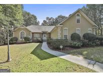 Ranch style home with stone accents and landscaped lawn at 365 Pendleton Trl, Tyrone, GA 30290