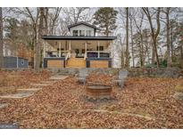 Lakefront home with expansive porch and firepit at 480 Mitchell Rd, Covington, GA 30014