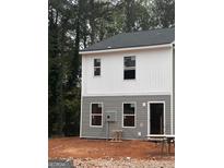 Two-story townhome with gray and white siding at 7270 Crestside Dr # 63, Austell, GA 30168