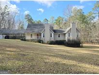 Ranch style home with large yard and mature trees at 110 Kari Glen Way, Fayetteville, GA 30215