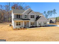 Two-story house with gray siding, white brick, and a large yard at 278 Deer Creek Run # 3-12, Moreland, GA 30259
