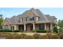 Two-story house with stone accents and a large front porch at 120 National Way, Carrollton, GA 30116