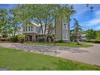 Unique two-story house with a tower and landscaped yard at 460 Dixie Rd, Covington, GA 30014