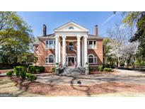 Brick two story home with columns and landscaped yard at 2204 Monticello St, Covington, GA 30014
