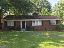 Brick ranch house with a well-maintained lawn at 1193 Clifton Rd, Atlanta, GA 30307